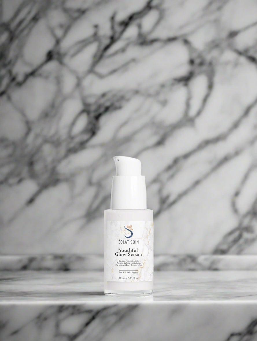 Eclat Soin Collagen Boost Serum in a sleek pump bottle on a marble surface